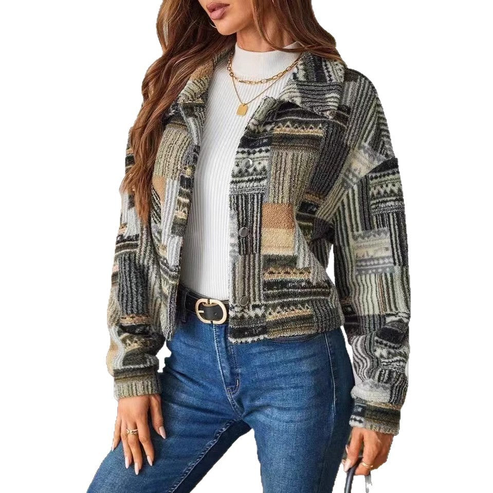 Woman wearing a patterned jacket and blue jeans on a white background