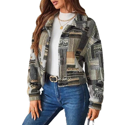Woman wearing a patterned jacket and blue jeans on a white background