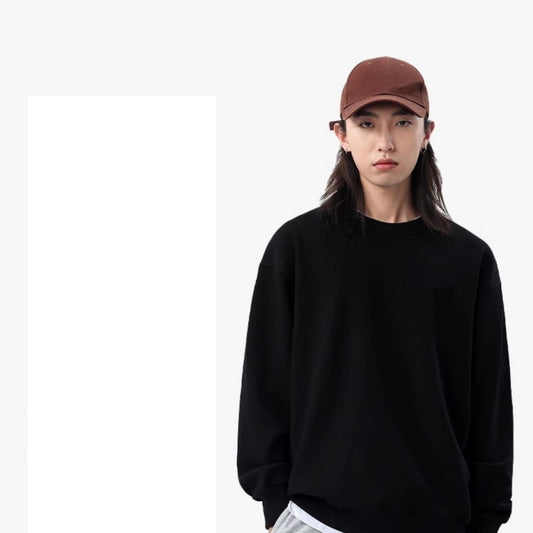 Person wearing a black sweatshirt and brown cap on a white background
